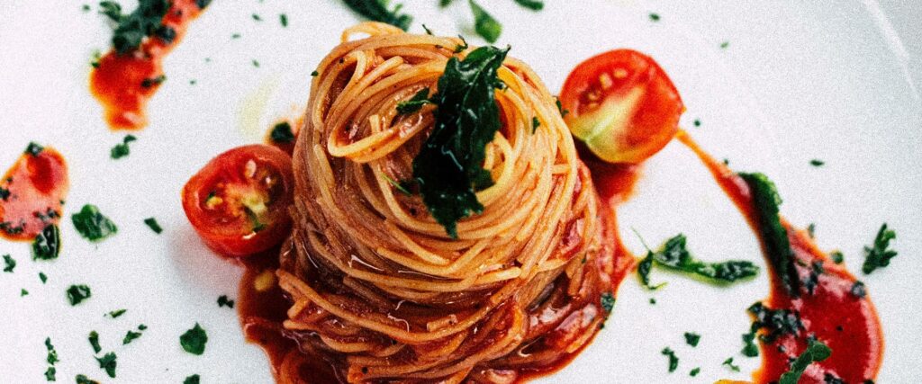 spaghetti pomodoro on a white dinner plate