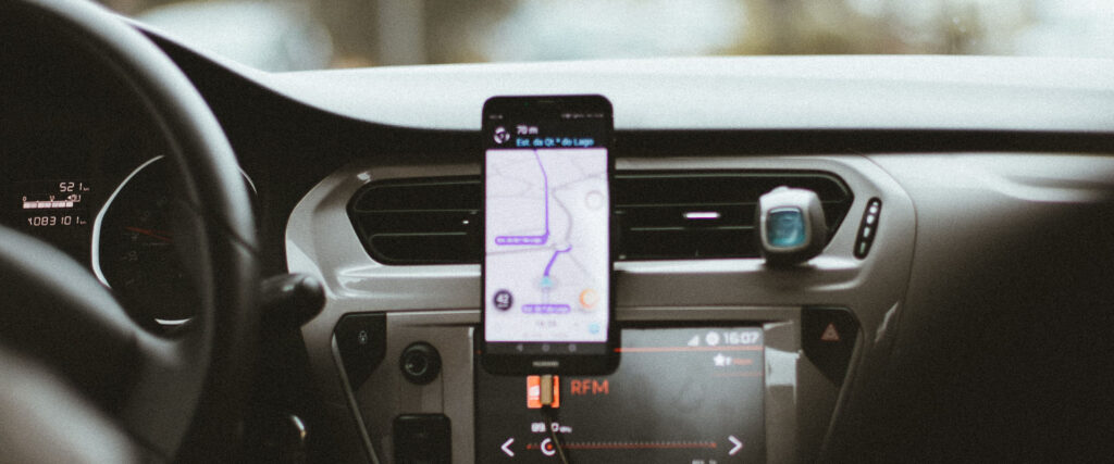 Car interior focused on mobile phone that is navigating