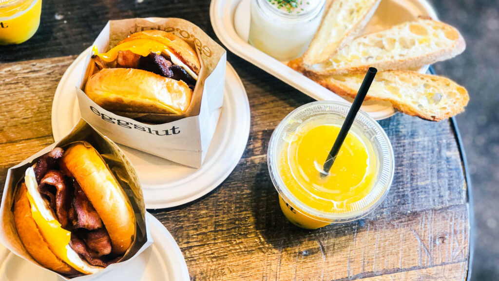 Breakfast at Eggslut with egg sandwiches and juice