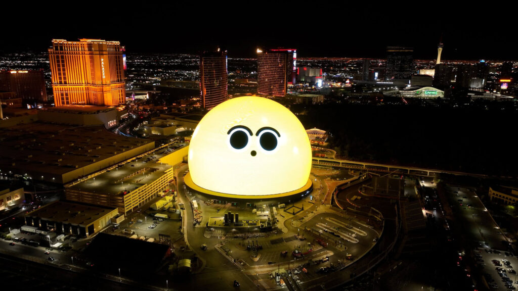 MSG Sphere aerial at night with a surprise emoji face